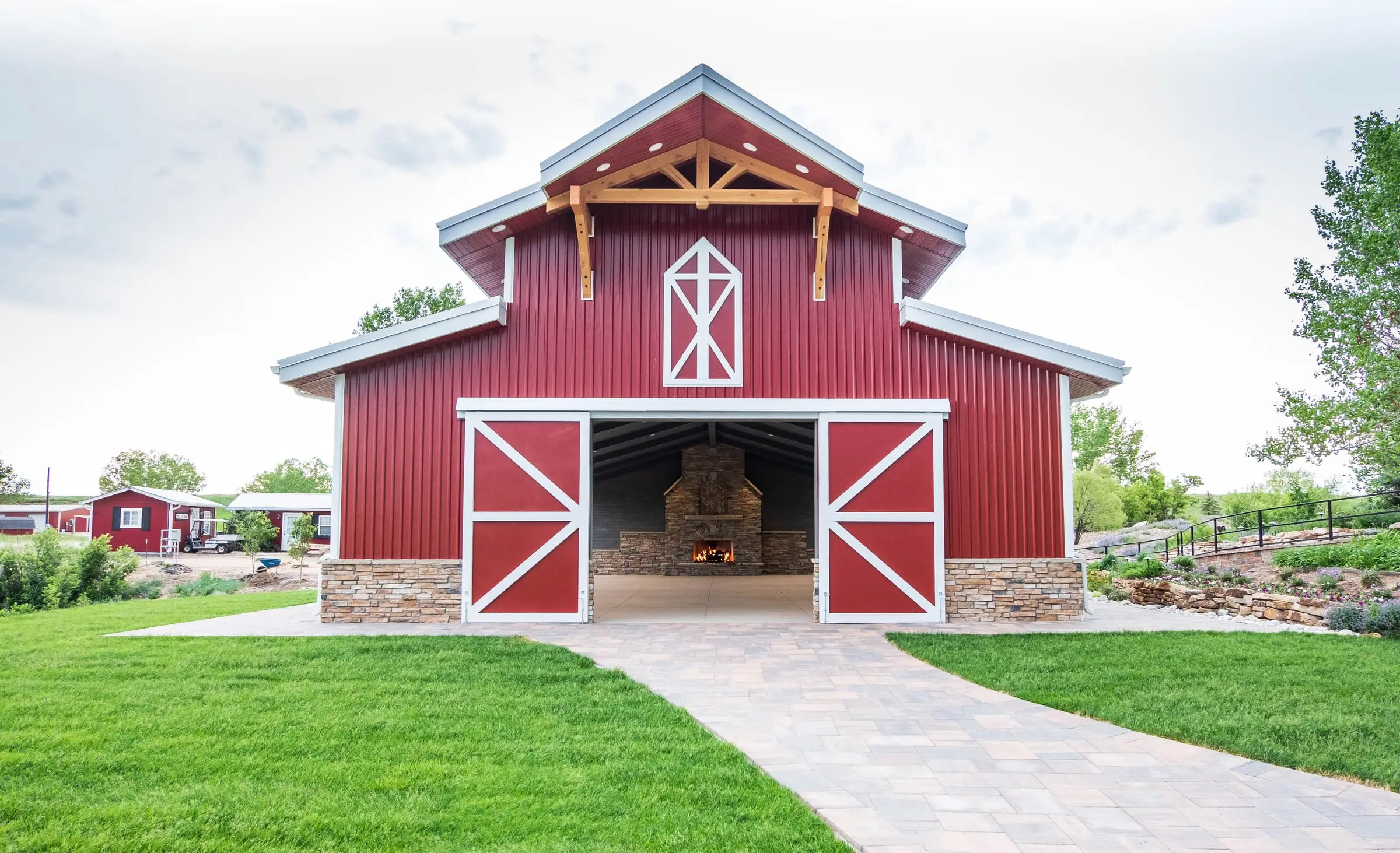 The red barn-style pavilion with white trim