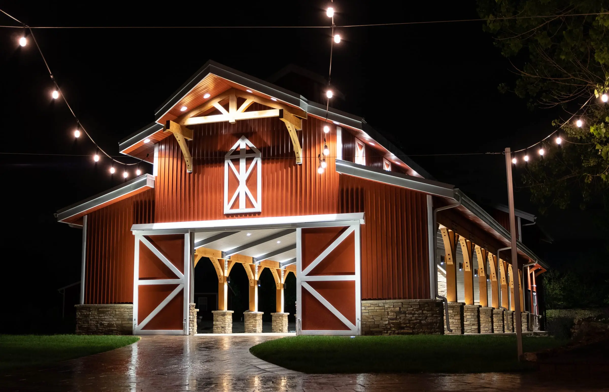The red pavilion lit up at night under market lights