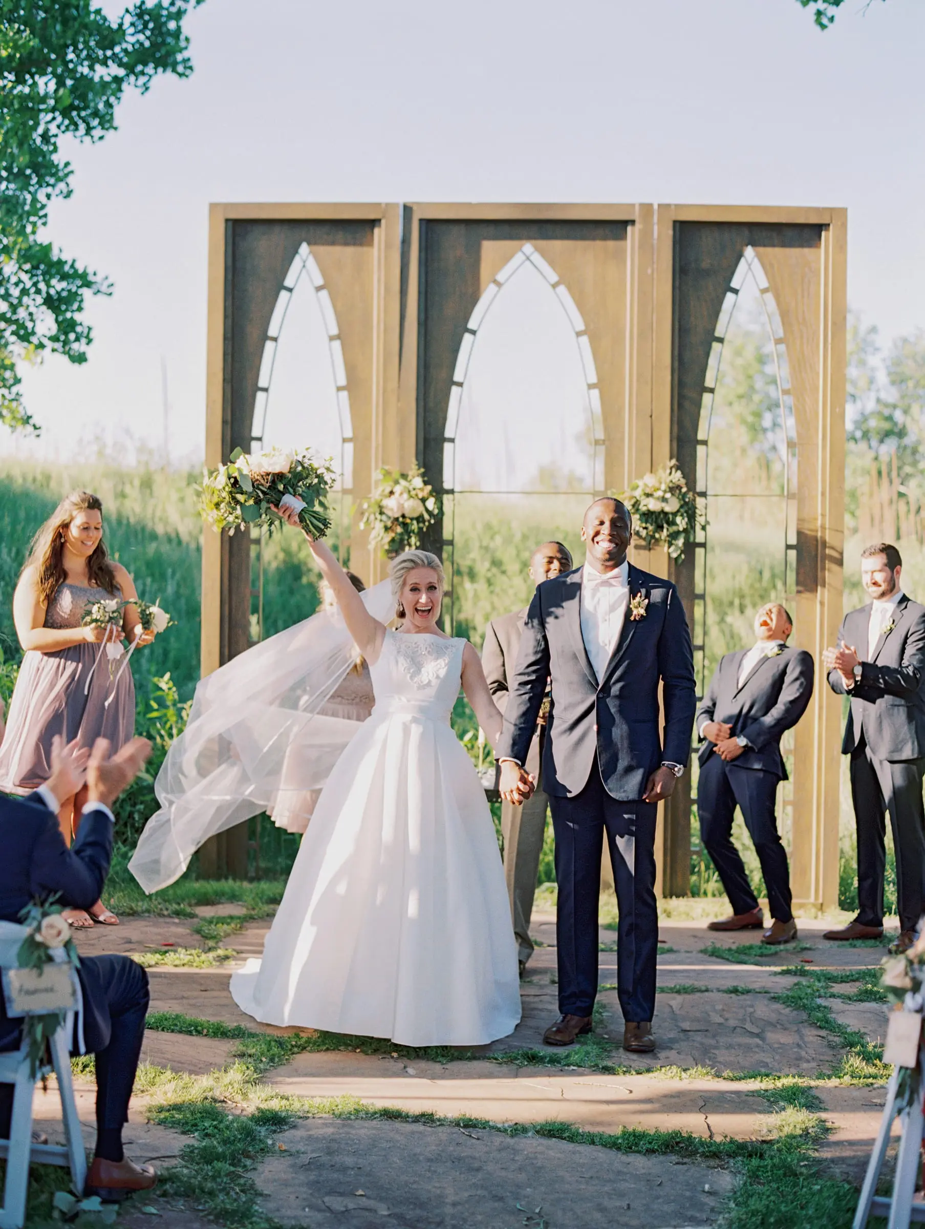 Bride and groom celebrating at the altar